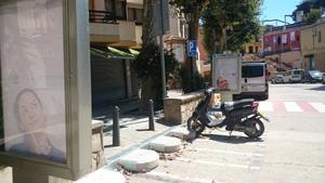 aparcament moto caldes estrac i panell informatiu